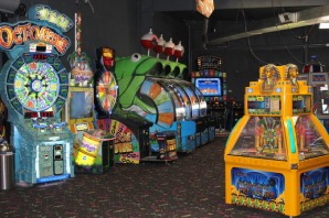 Rows of games glowing inside the Kart Kountry arcade