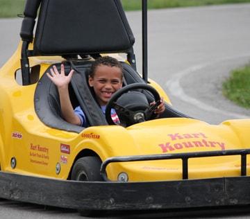 A young driver enjoying a lap at Kart Kountry